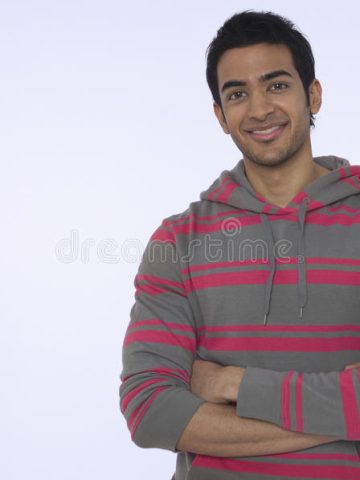 smiling-young-indian-man-portrait-against-purple-background-33897262